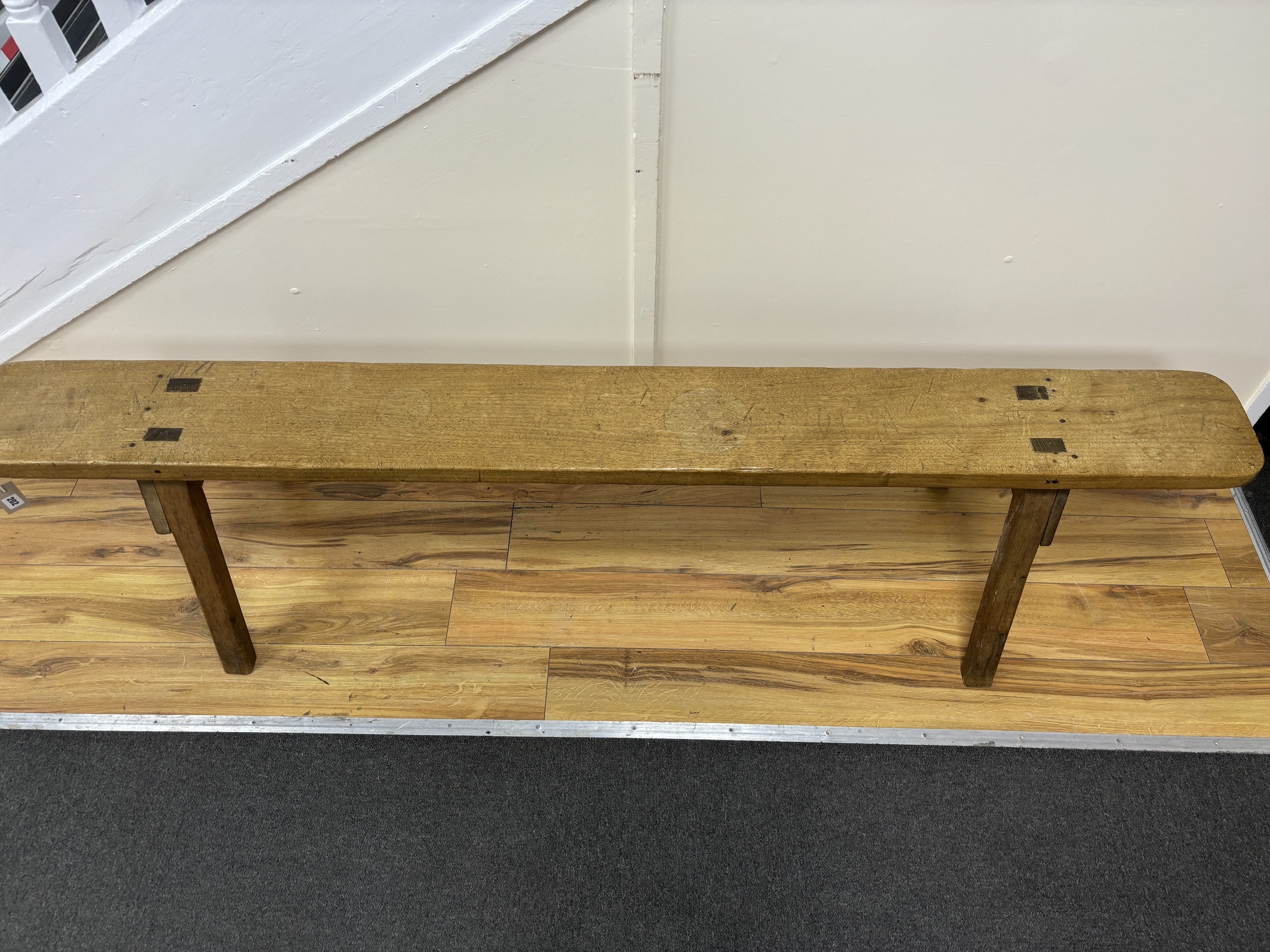 A 19th century French fruitwood bench seat, length 197cm, height 45cm